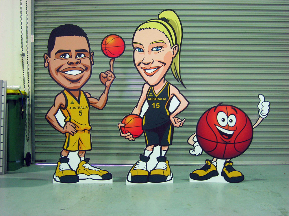 custom cartoon cut outs of male and female basketball players and a basketball cutout