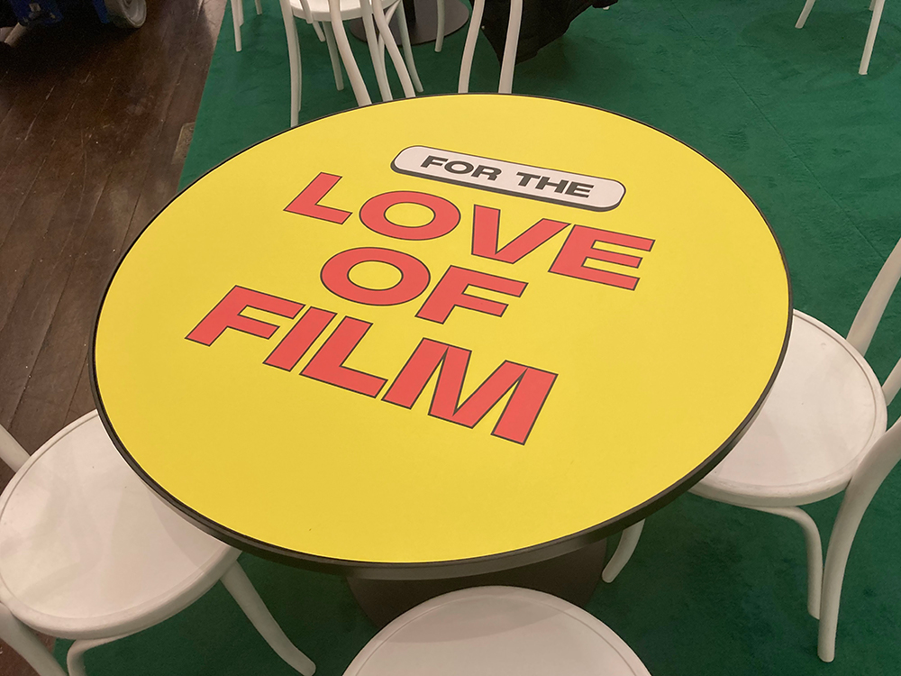 yellow table graphic with red text that reads "for the love of film"