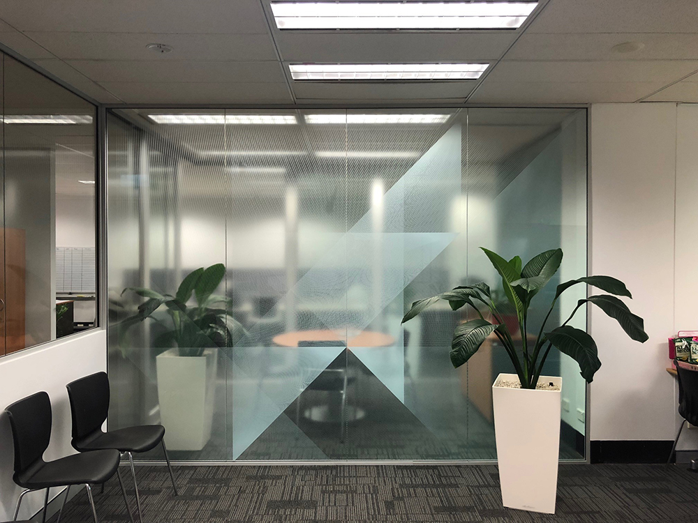 custom imaged glass with brand logo inside office space